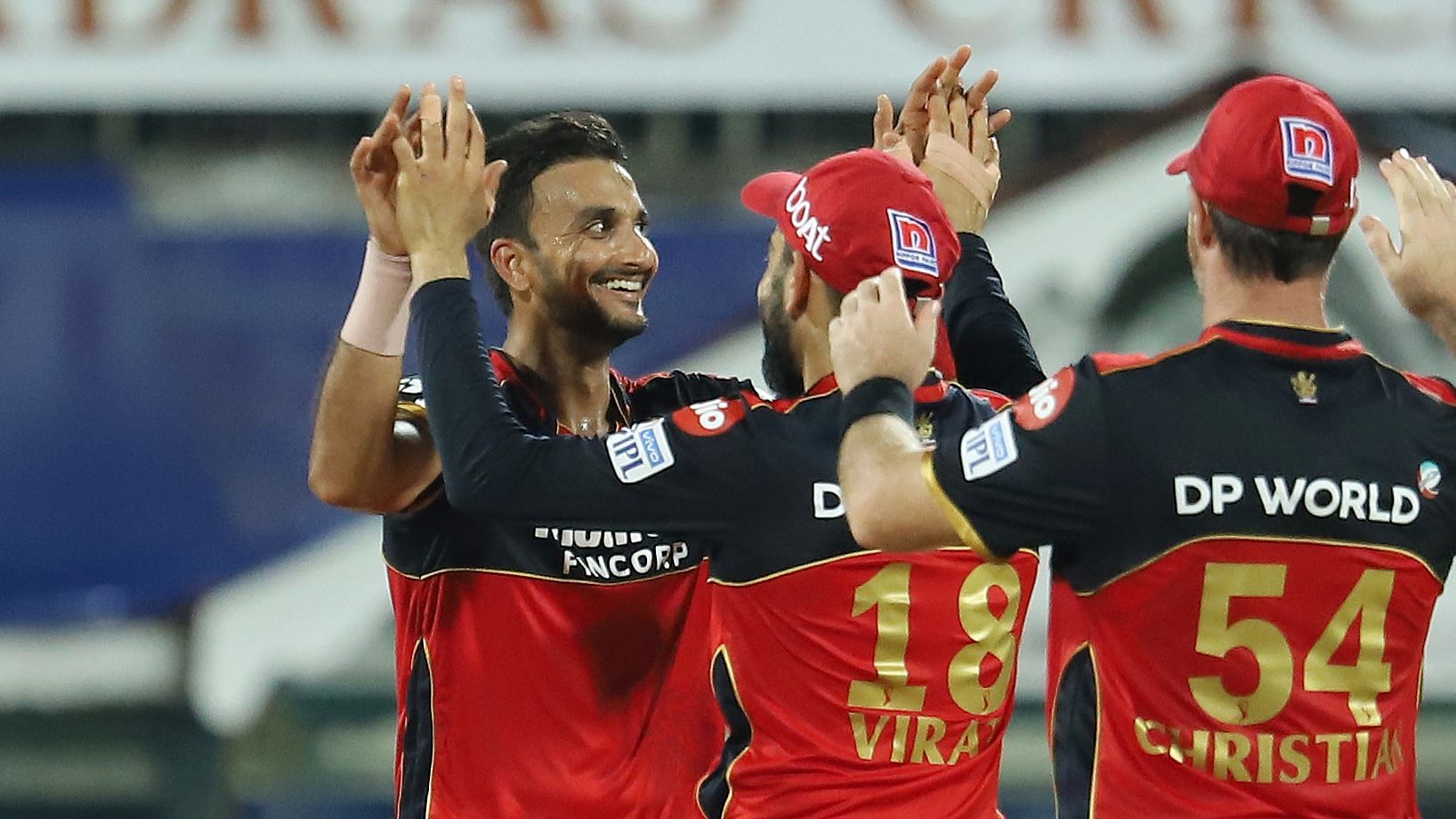 Harshal Patel celebrates one of his five wickets in the 2021 IPL season-opener against Mumbai Indians.