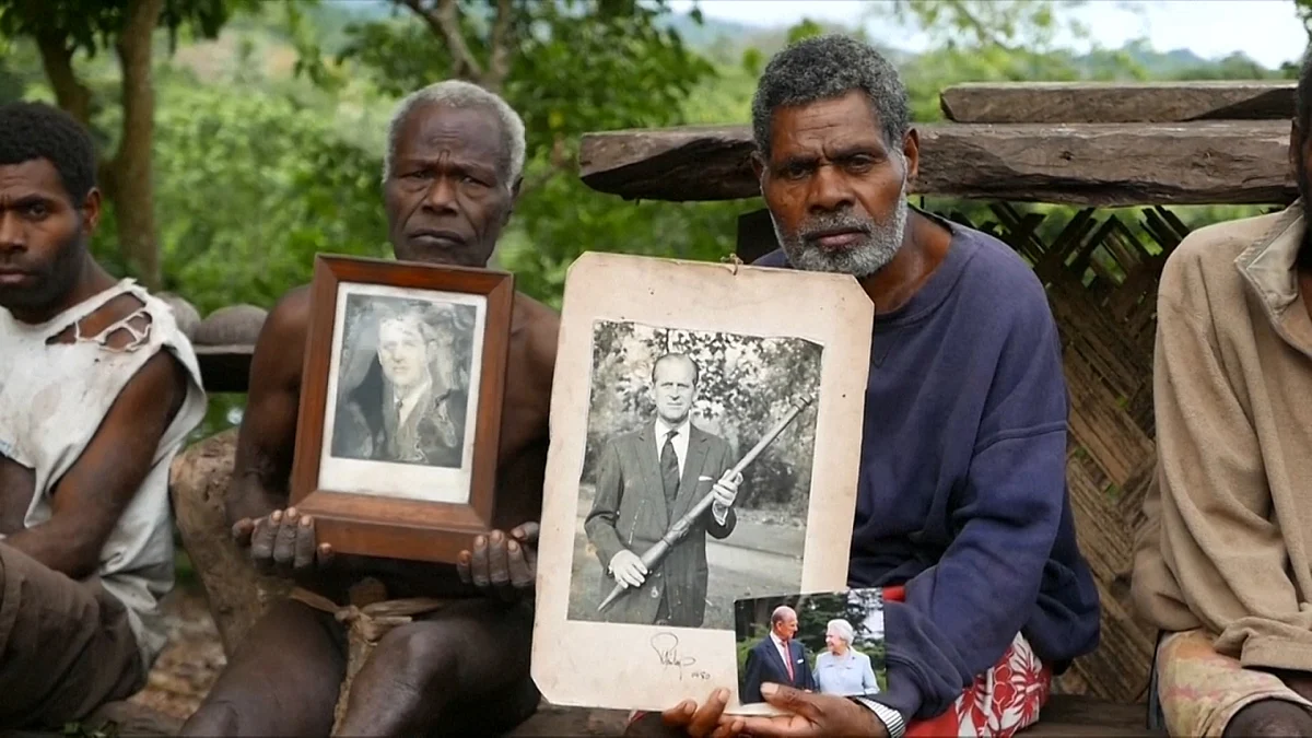 <div class="paragraphs"><p>The people of Tana posing with a portrait of Prince Philip.</p></div>