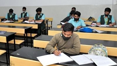 Image of students writing an exam, used for representation purpose.