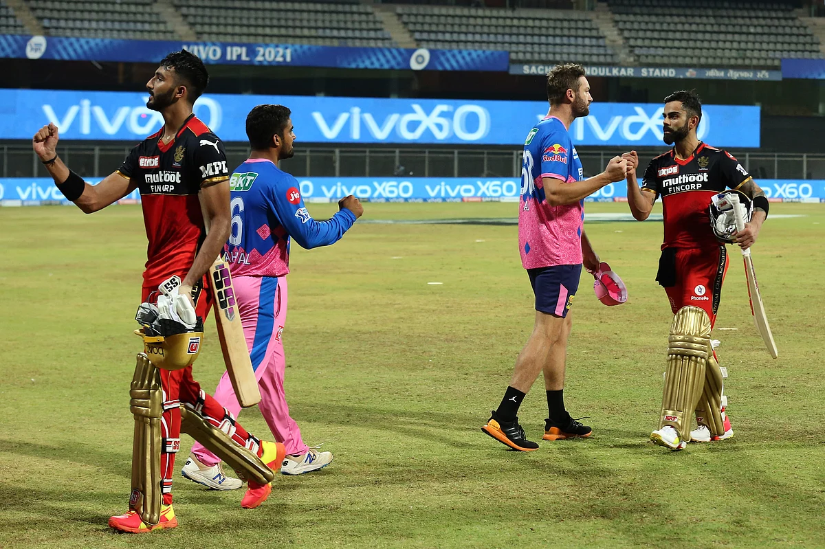 Virat Kohli Captain of Royal Challengers Bangalore shake hands with players during match 16 of the Vivo Indian Premier League 2021 between the Royal Challengers Bangalore and the Rajasthan Royals.