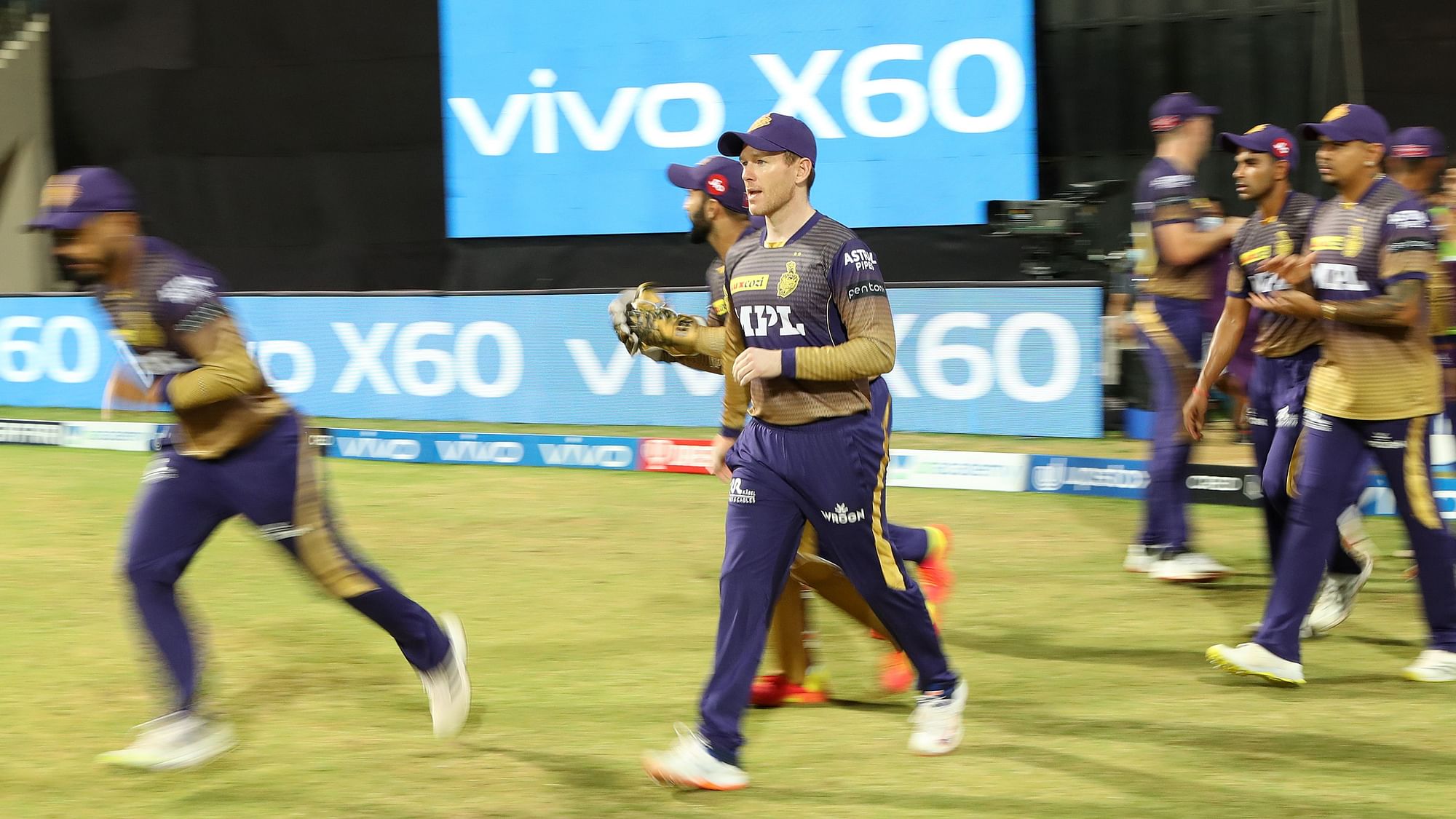 Eoin Morgan leads out the KKR team to field