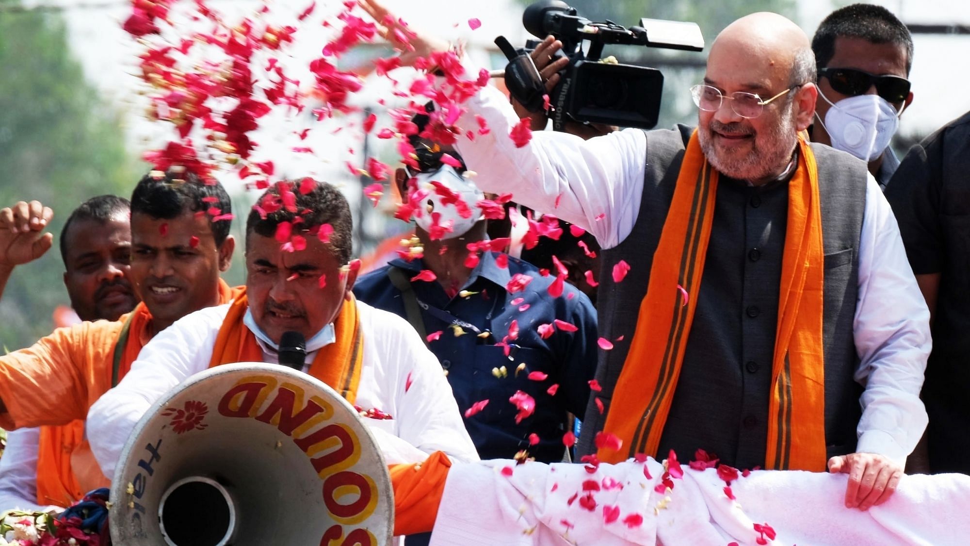  Union Home Minister Amit Shah along with Suvendu Adhikari during a roadshow in Nandigram on 30 March.
