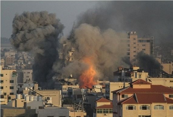 Heavy smoke rises following an Israeli air strike in central Gaza City, on 12 May, 2021.