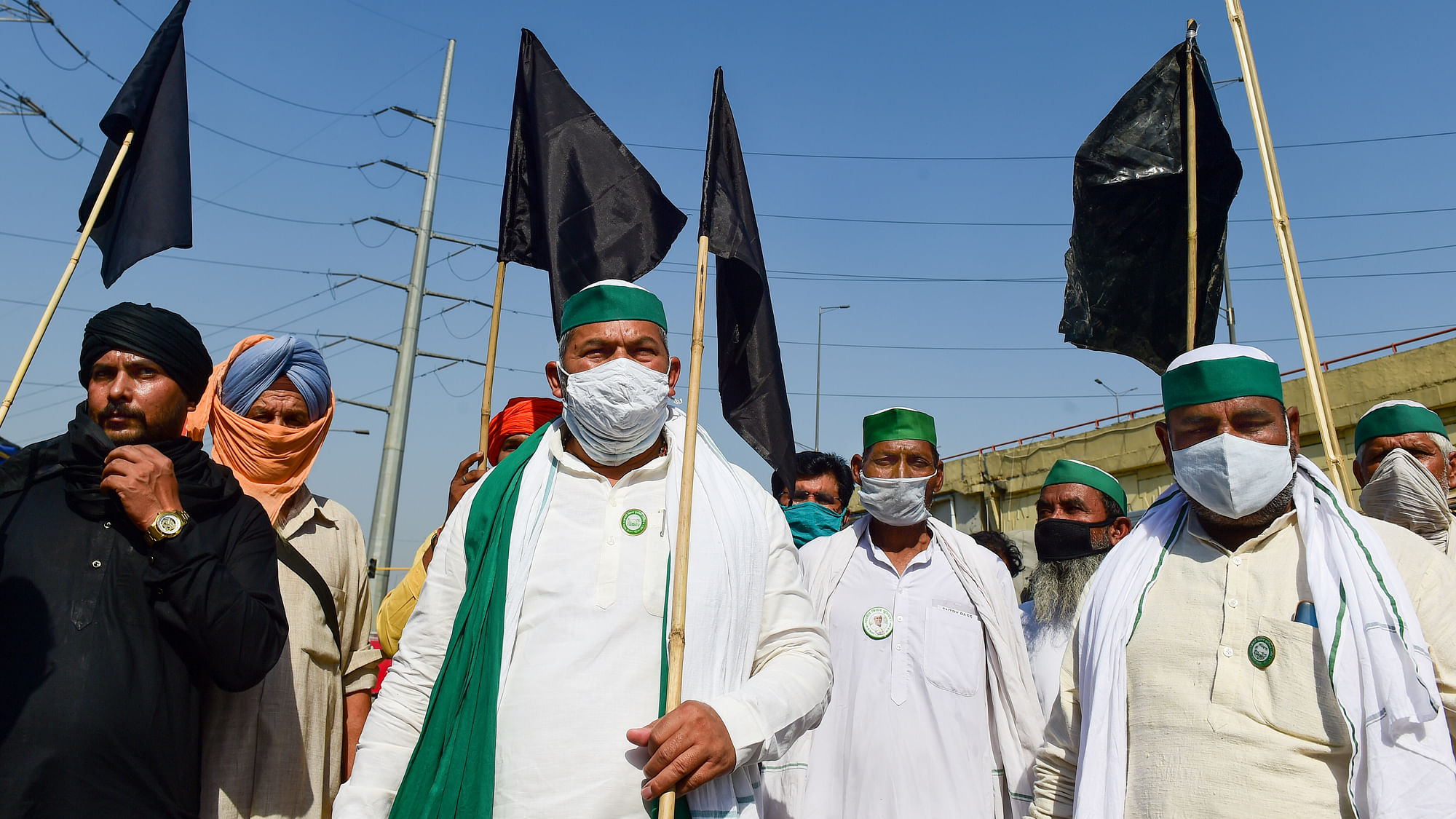 BKU leader Rakesh Tikait, with supporters and farmers, protests with black flags against farm laws, at Ghazipur border in New Delhi, Wednesday, 26 May 2021.