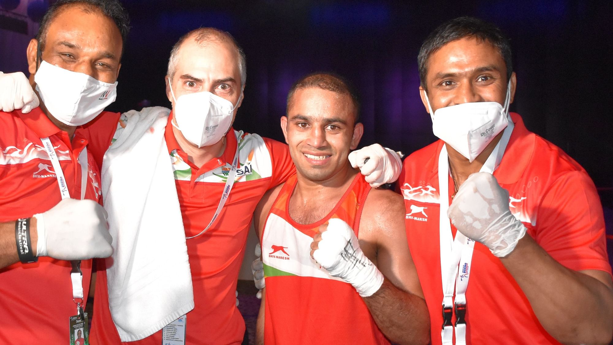 Amit Panghal with his team after entering the final of the 54kg category at the Asian Boxing Championship in Dubai on Friday night.