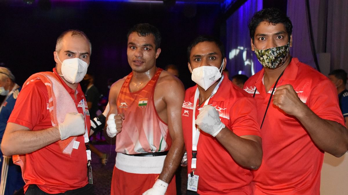 Amit Panghal, Vikas Krishan, and Varinder Singh qualified for the semi-finals of the Asian Boxing Championships.