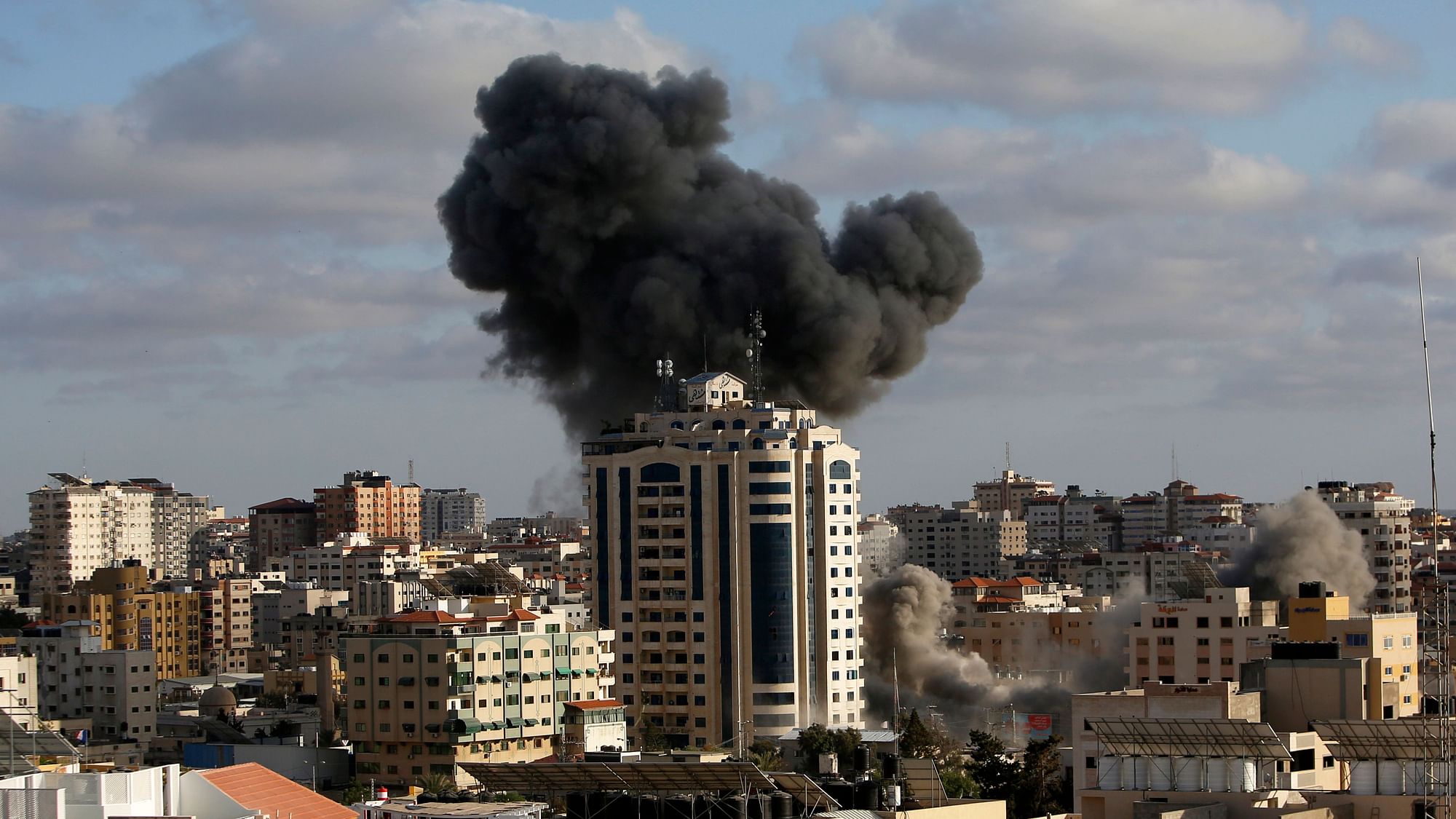 An Israeli air strike hits a building in Gaza City, Monday, May 17, 2021. The Israeli military had unleashed a wave of heavy airstrikes Monday on the Gaza Strip.