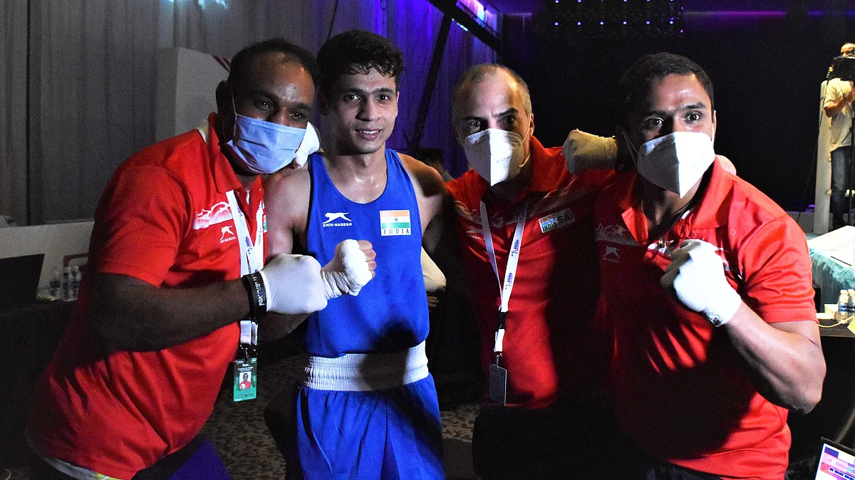 Varinder ( 60kg) celebrates with the coaches after winning his quarter final bout and securing bronze medal at ASBC Asian Championships in Dubai on Wednesday