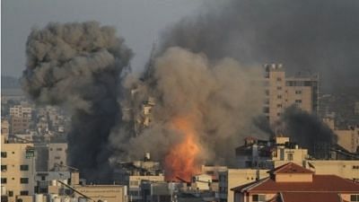 <div class="paragraphs"><p>Heavy smoke rises following an Israeli air strike in central Gaza City, on May 12, 2021. </p></div>