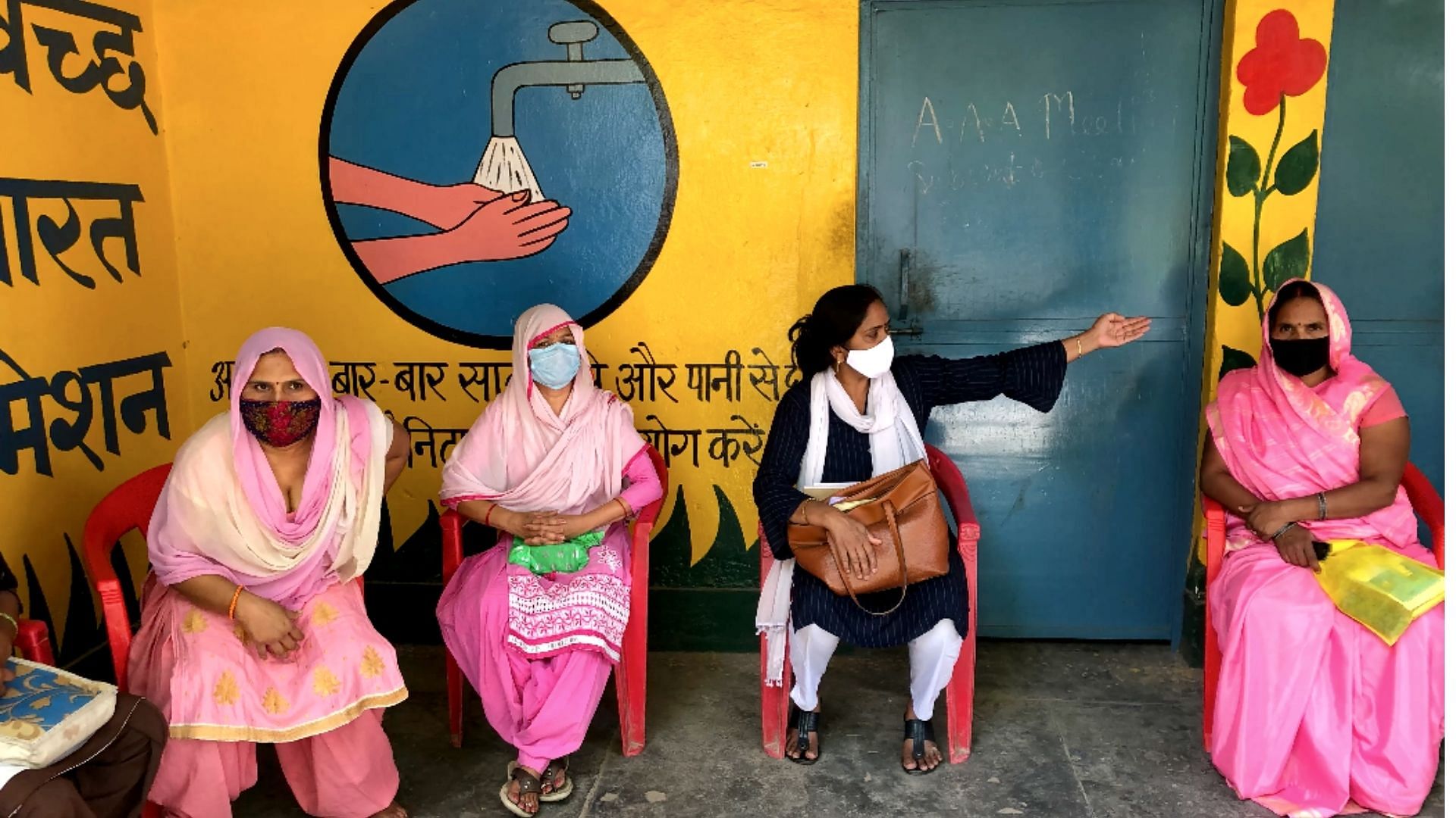 ASHA workers meeting the village <i>pradhan</i> in Meerut’s Gagol village.