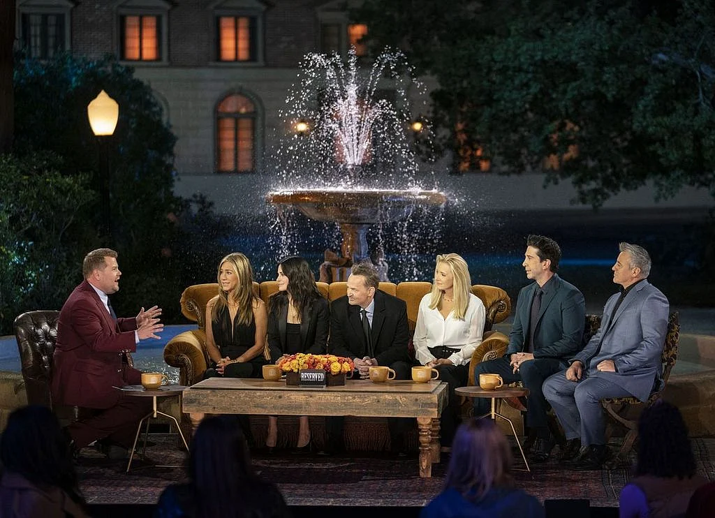 The cast of <i>Friends</i> in front of the iconic fountain, with James Corden.