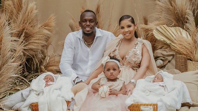 Usain Bolt with his partner Kasi Bennett and children