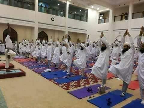 None of the pictures show yoga being practiced in Saudi Arabia. One is from Abu Dhabi and the other  from Ahmedabad.