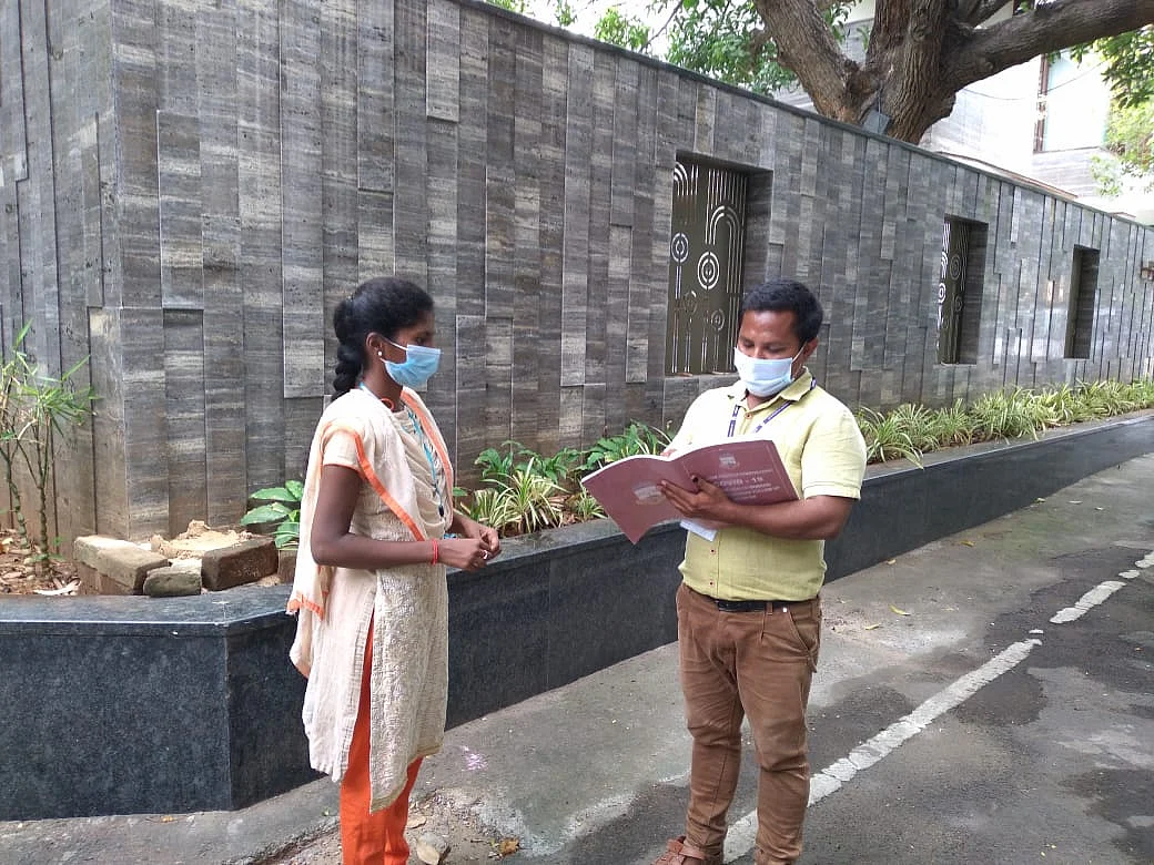 Health workers take stock of the daily COVID report