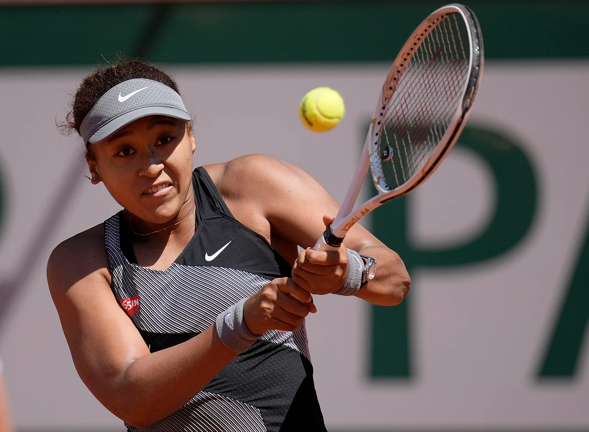 <div class="paragraphs"><p>Paris: Japan's Naomi Osaka returns the ball to Romania's Patricia Maria Tig during their first round match of the French open tennis tournament at the Roland Garros stadium Sunday, May 30, 2021.</p></div>