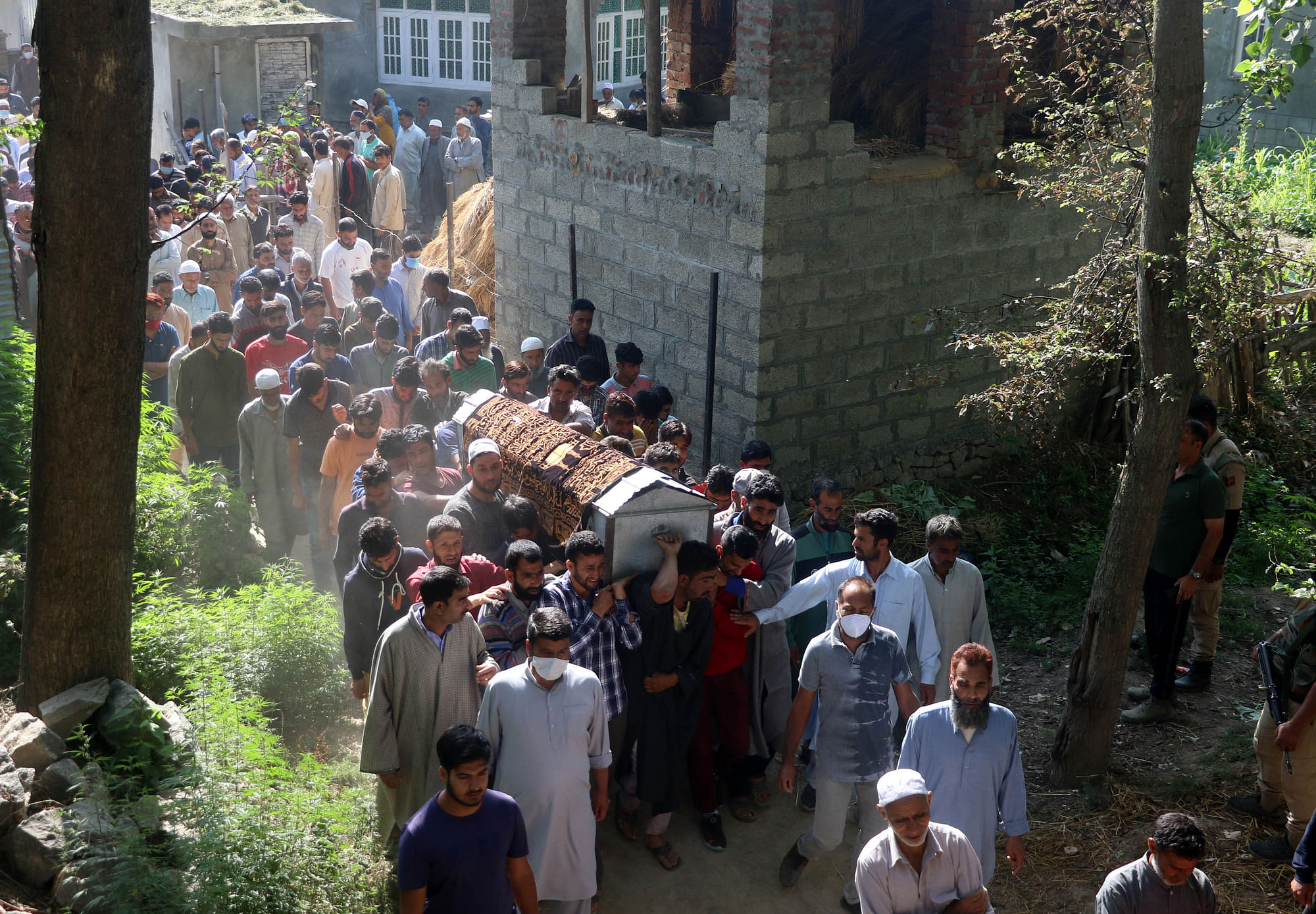 The funeral procession of Fayaz Ahmed and his family after they were shot dead by militants in Kashmir.