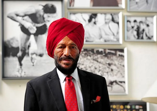 Veteran Milkha Singh posing with his long litany of accolades in the background. 