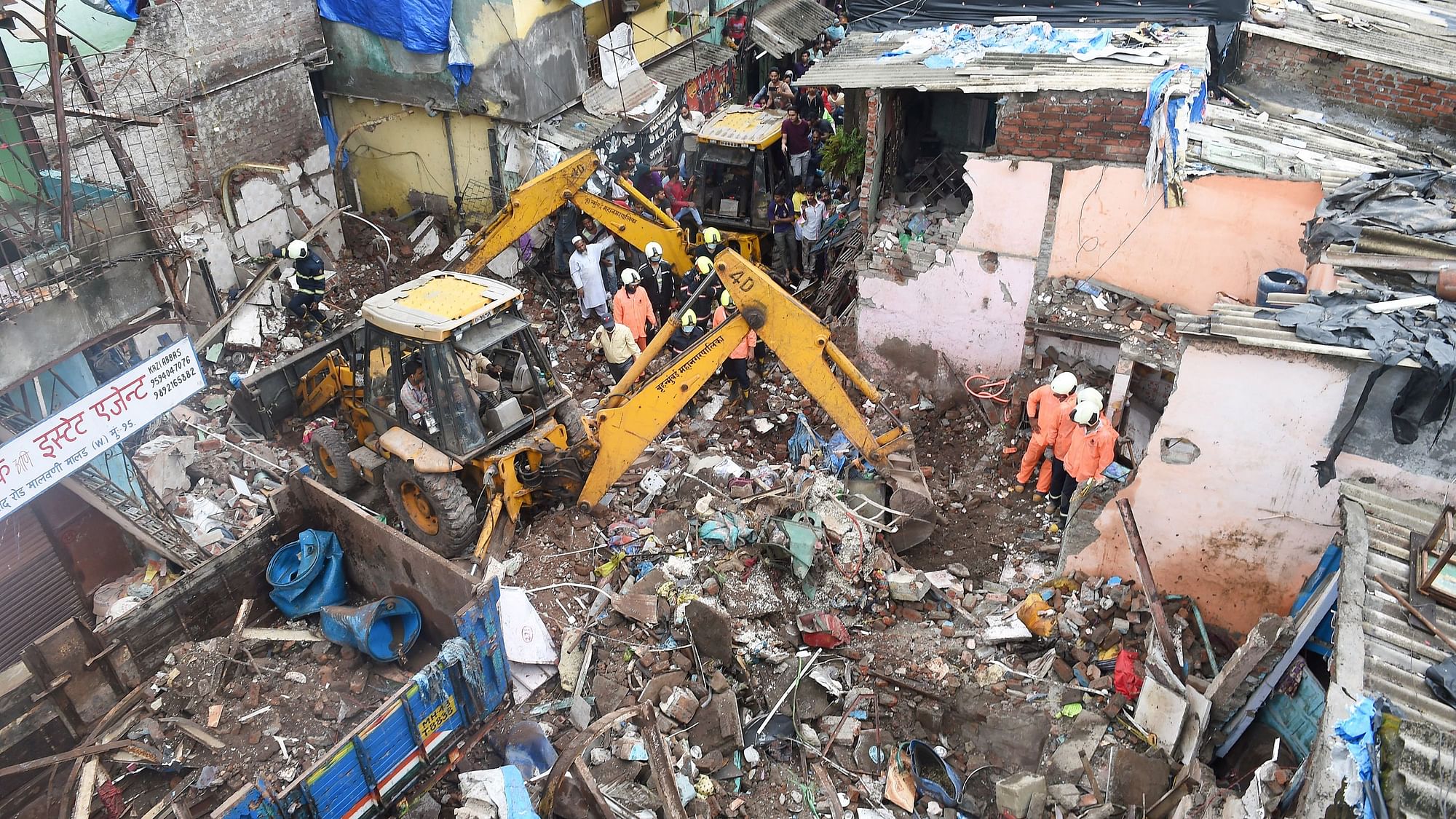Rescue operations underway after a building collapsed on another structure in Mumbai.&nbsp;