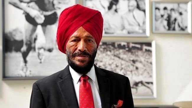 Veteran Milkha Singh posing with his long litany of accolades in the background.&nbsp;