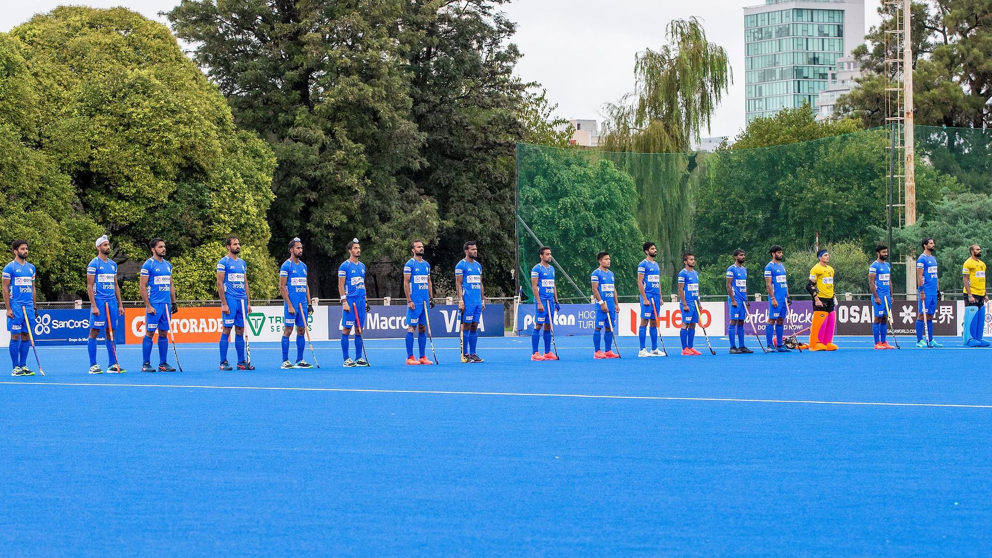 The Indian men’s hockey team line up for the national anthem.&nbsp;