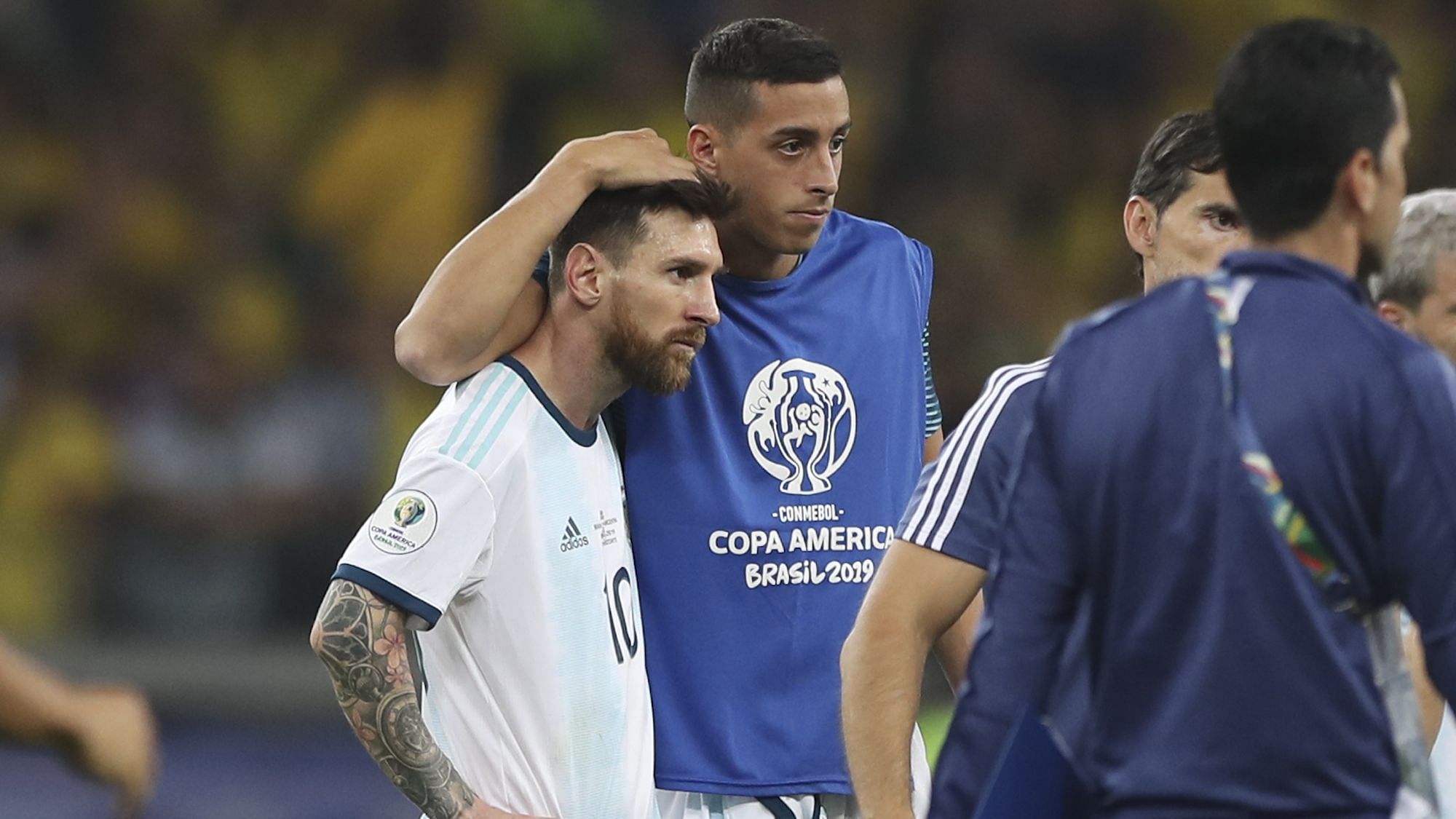 A teammate embraces Argentina’s Lionel Messi after losing 0-2 to Brazil in a Copa America semifinal soccer match at the Mineirao stadium in Belo Horizonte, Brazil.