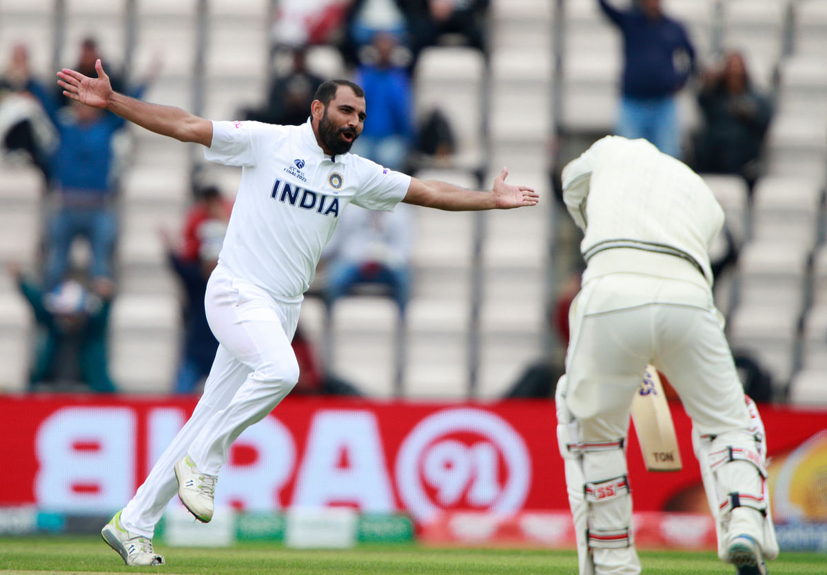 India’s Mohammed Shami, left, celebrates the dismissal of New Zealand’s BJ Watling, right, during the fifth day of the World Test Championship final cricket match between New Zealand and India.