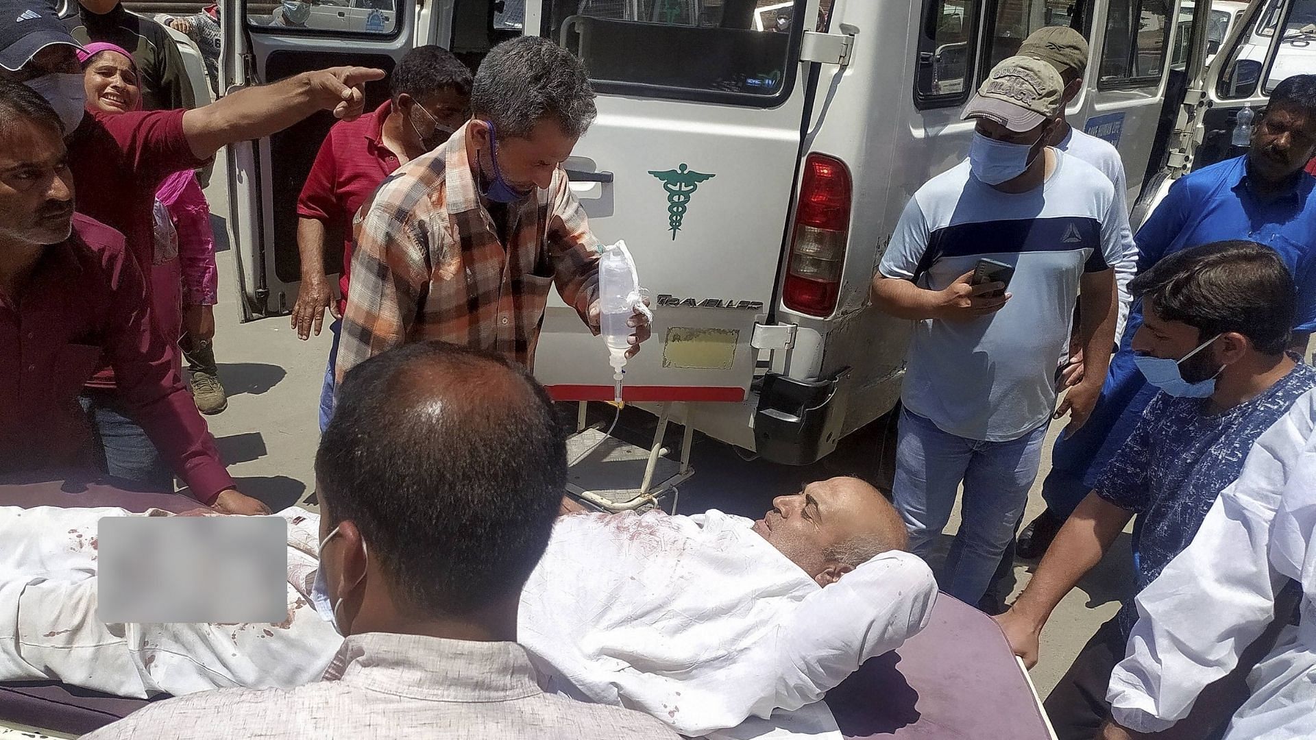 An injured civilian being admitted to a hospital after militants opened fire targeting security forces in Sopore town of Baramulla district, in Srinagar, Saturday, 12 June.