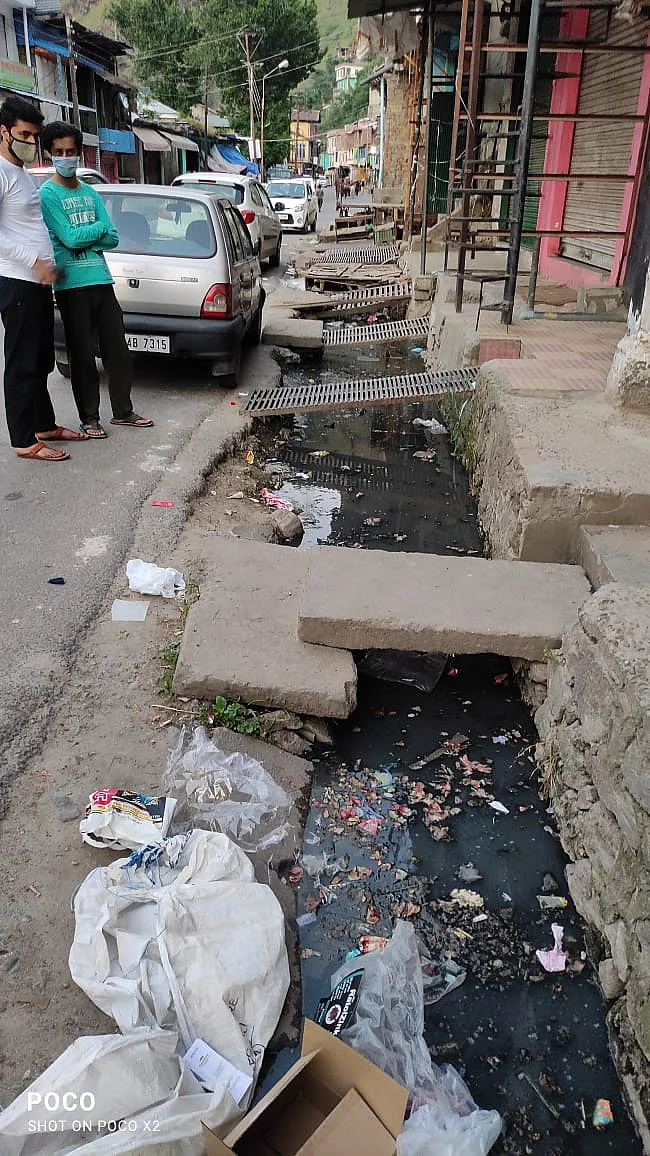 Sewage and garbage accumulates in drains.
