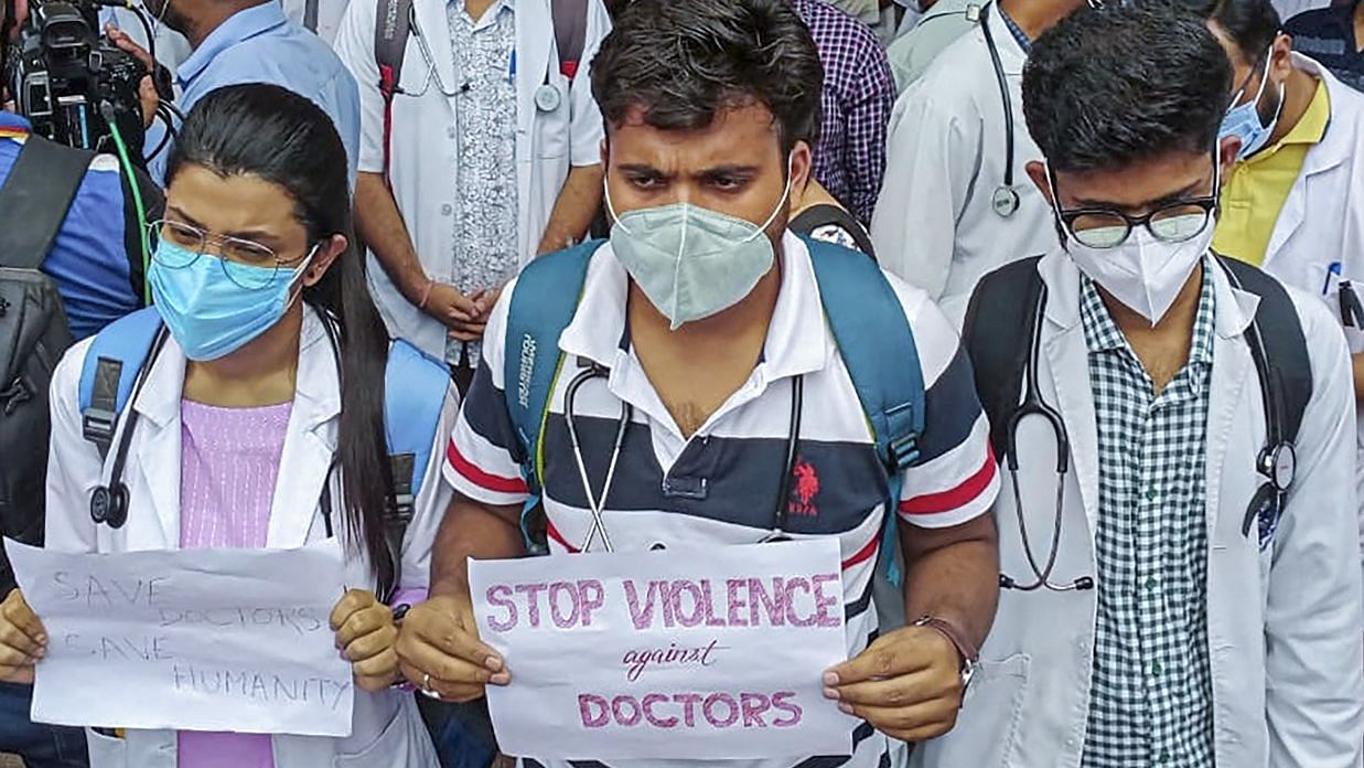 Doctors hold placards as they protest against the mishandling of Dr Seuj Kumar Senapati in Guwahati.