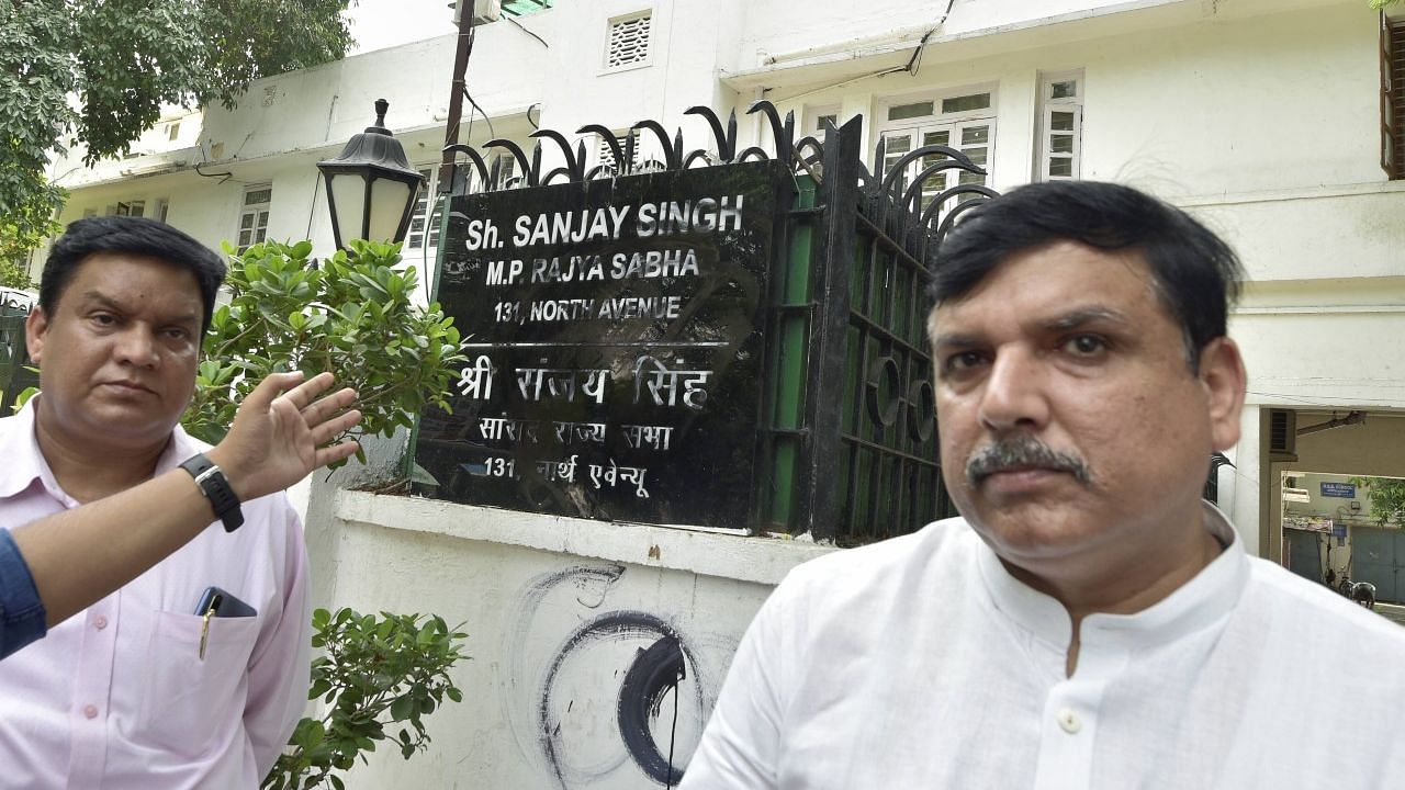 AAP MP Sanjay Singh outside his residence in New Delhi, as the police said an attempt was made to deface his nameplate.