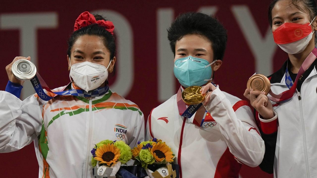 <div class="paragraphs"><p>Tokyo Olympics: Mirabai Chanu (extreme left) won Silver in the 49 kg event.</p></div>