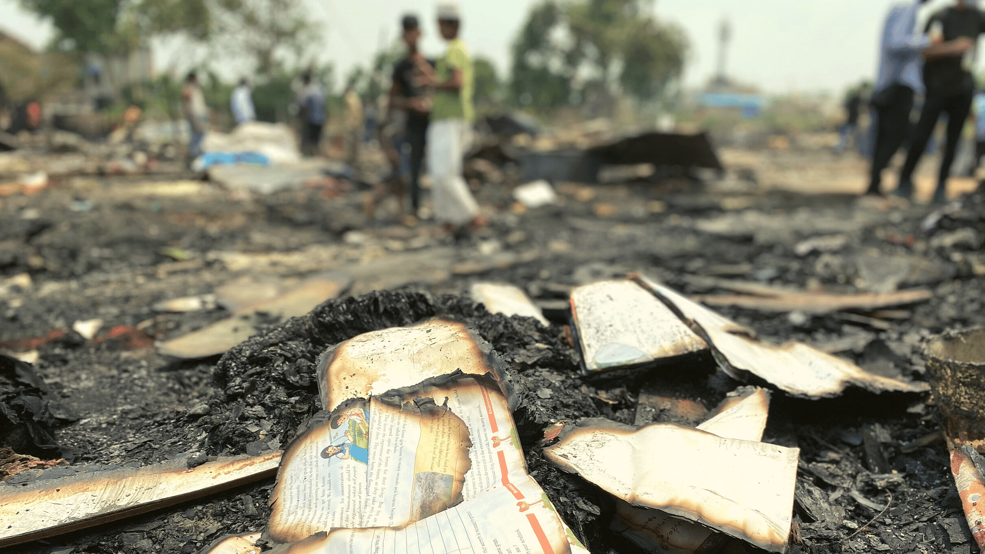 <div class="paragraphs"><p>Remnants of school books, destroyed in the Rohingya camp fire on 12 June.&nbsp;</p></div>