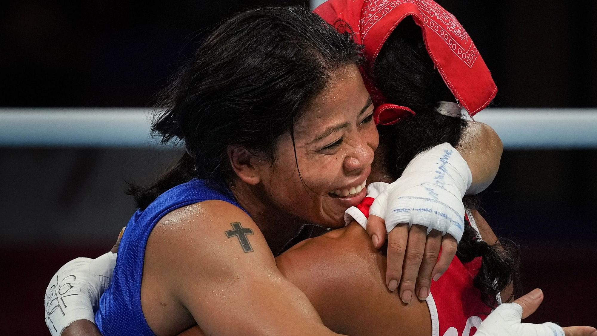 <div class="paragraphs"><p>MC Mary Kom embraces her opponent after the Round of 16 match at the 2020 Tokyo Olympics.</p></div>