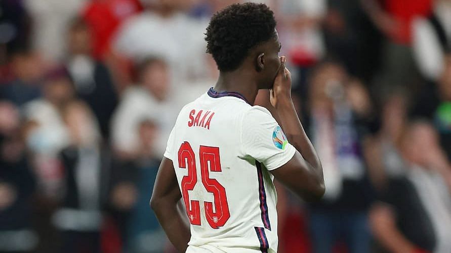 <div class="paragraphs"><p>Bukayo Saka reacts after missing his penalty against Italy in the Euro 2020 final.&nbsp;</p></div>