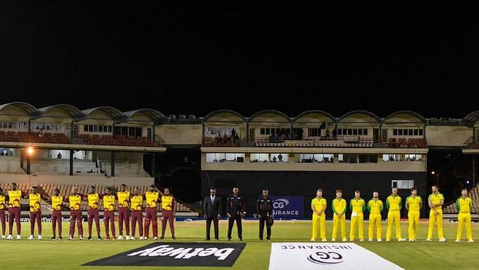 <div class="paragraphs"><p>West Indies and Australia players line up for the national anthem.</p></div>