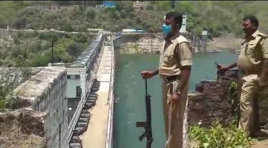 <div class="paragraphs"><p>Police personnel of Telangana stand guard near a&nbsp; hydel power project  on Krishna river.&nbsp;</p></div>