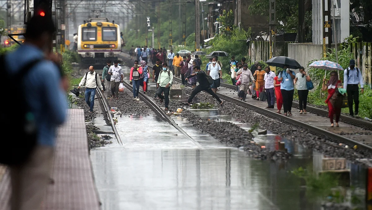 <div class="paragraphs"><p>Mumbai: People walk on railway tracks after local train services were affected due to waterlogging after heavy rains, at Sion in Mumbai<br></p></div><div class="paragraphs"><p><br></p></div>