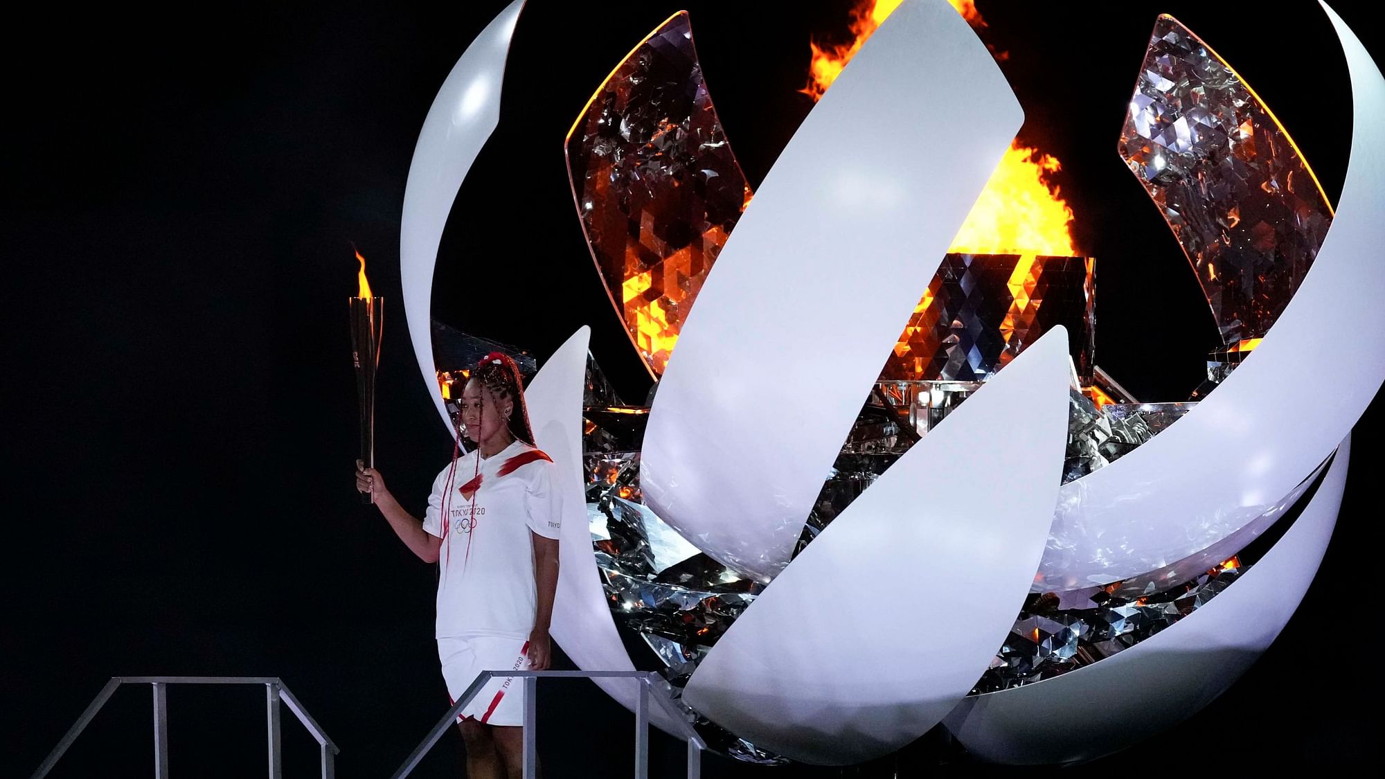 <div class="paragraphs"><p>Tokyo: Japan's Naomi Osaka reacts after lighting the cauldron during the opening ceremony in the Olympic Stadium at the 2020 Summer Olympics.</p></div>