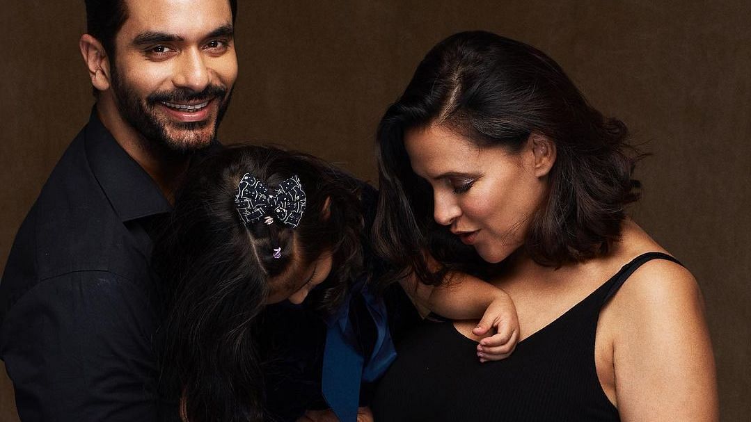 <div class="paragraphs"><p>Angad Bedi and Neha Dhupia with their first child Mehr</p></div>