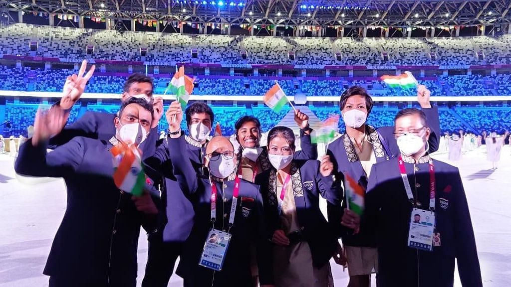 The 25-member Indian Contingent could be seen smiling behind their masks