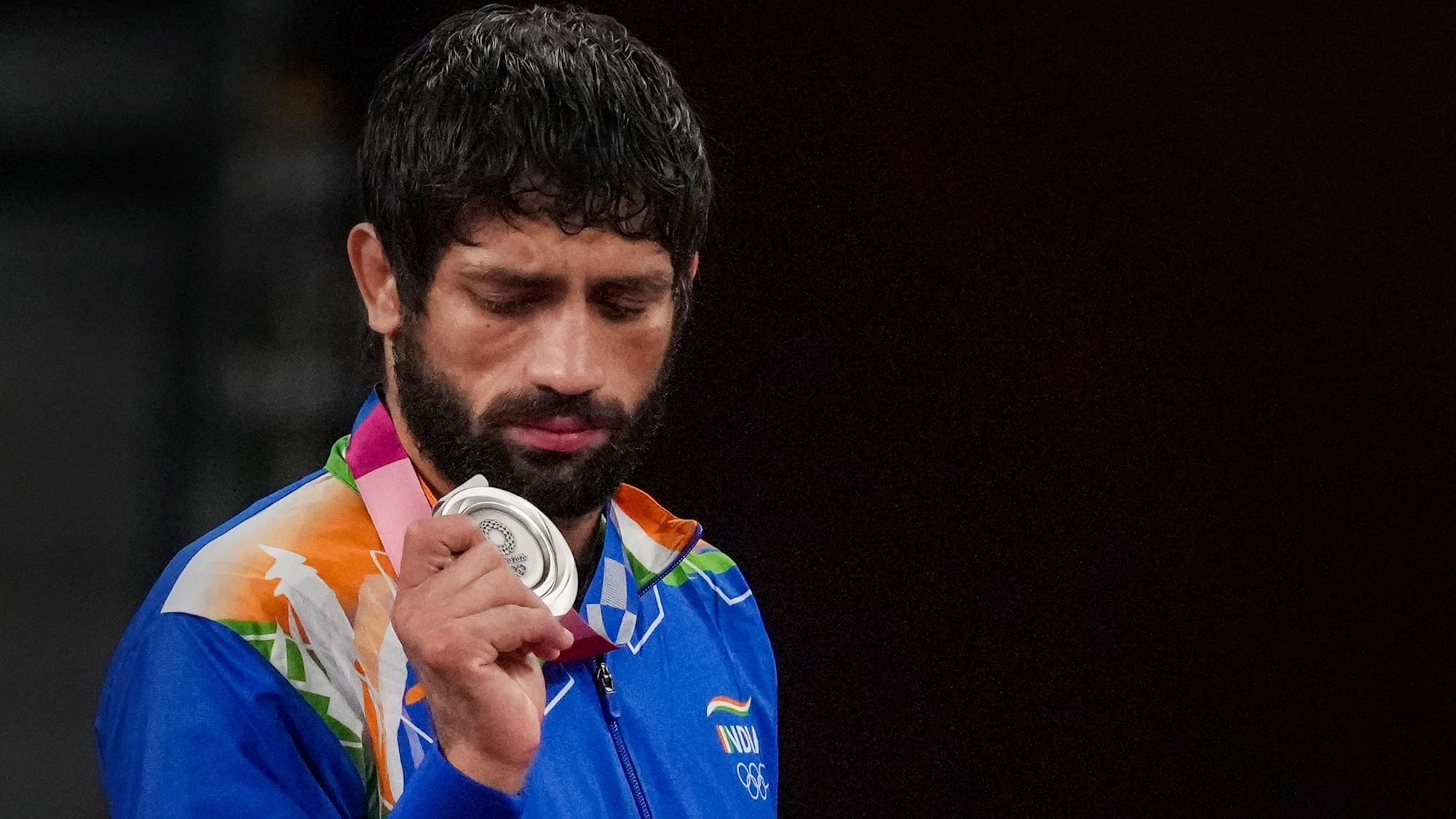 <div class="paragraphs"><p>India's Ravi Dahiya holds his silver medal during the medal ceremony after winning the Men's Freestyle Wrestling at the 2020 Summer Olympics, in Tokyo, 5 August.</p></div>