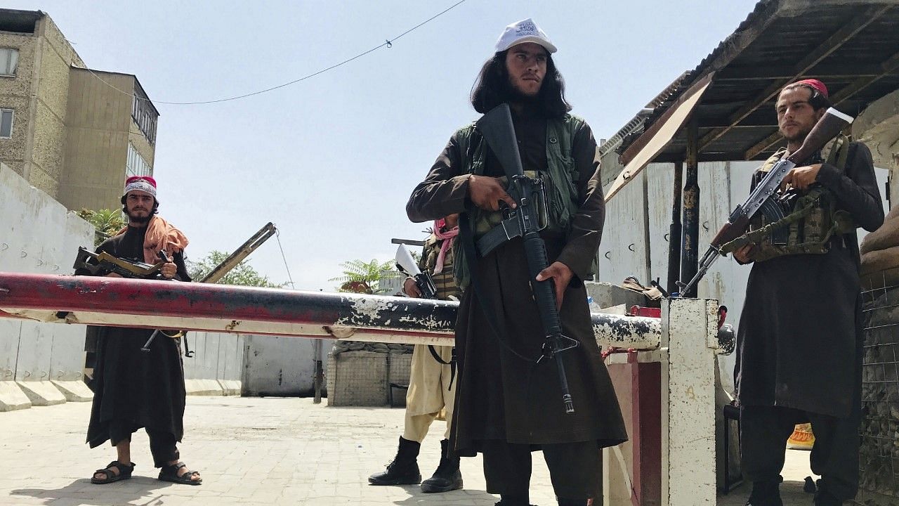 <div class="paragraphs"><p>Taliban fighters stand guard at a checkpoint near the US embassy that was previously manned by American troops, in Kabul, Afghanistan.</p></div>