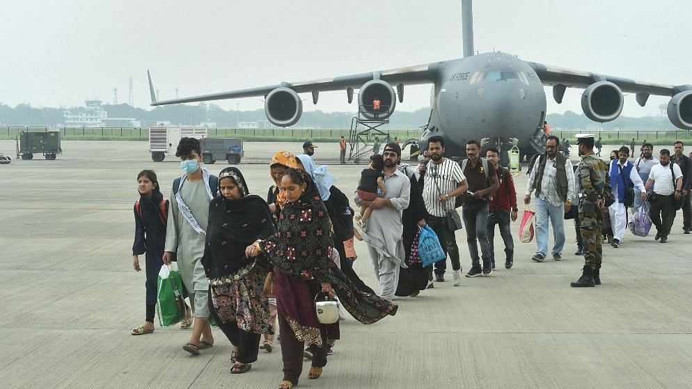 <div class="paragraphs"><p>Ghaziabad: People who were stranded in crisis-hit Afghanistan arrived by a special repatriation flight of IAF at the Hindan Air Force Station, 22 August.</p></div>