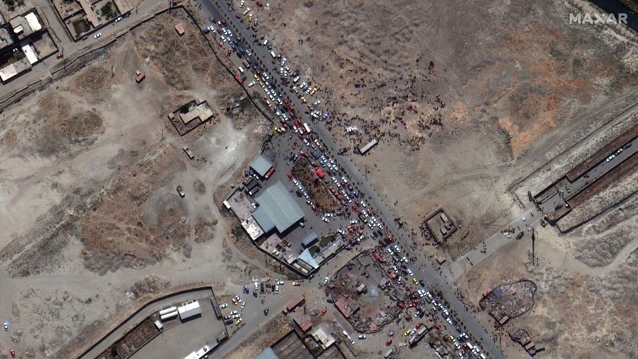 <div class="paragraphs"><p>This satellite image provided by Maxar Technologies shows crowds and traffic at the northern gate of Kabul's international airport in Afghanistan.&nbsp;</p></div>