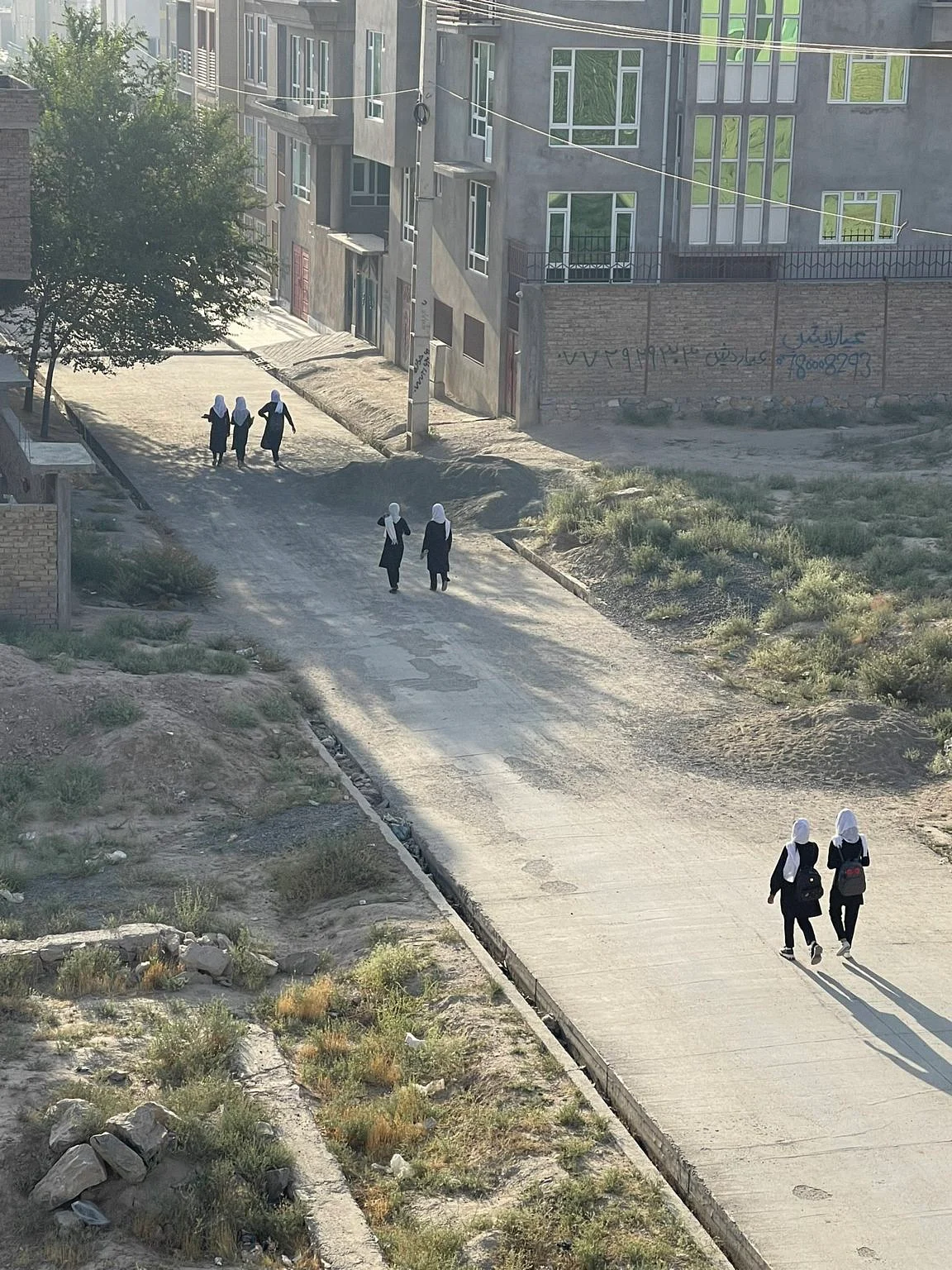 <div class="paragraphs"><p>Afghan girls walking to school a day after Taliban took control of Kabul.</p></div>