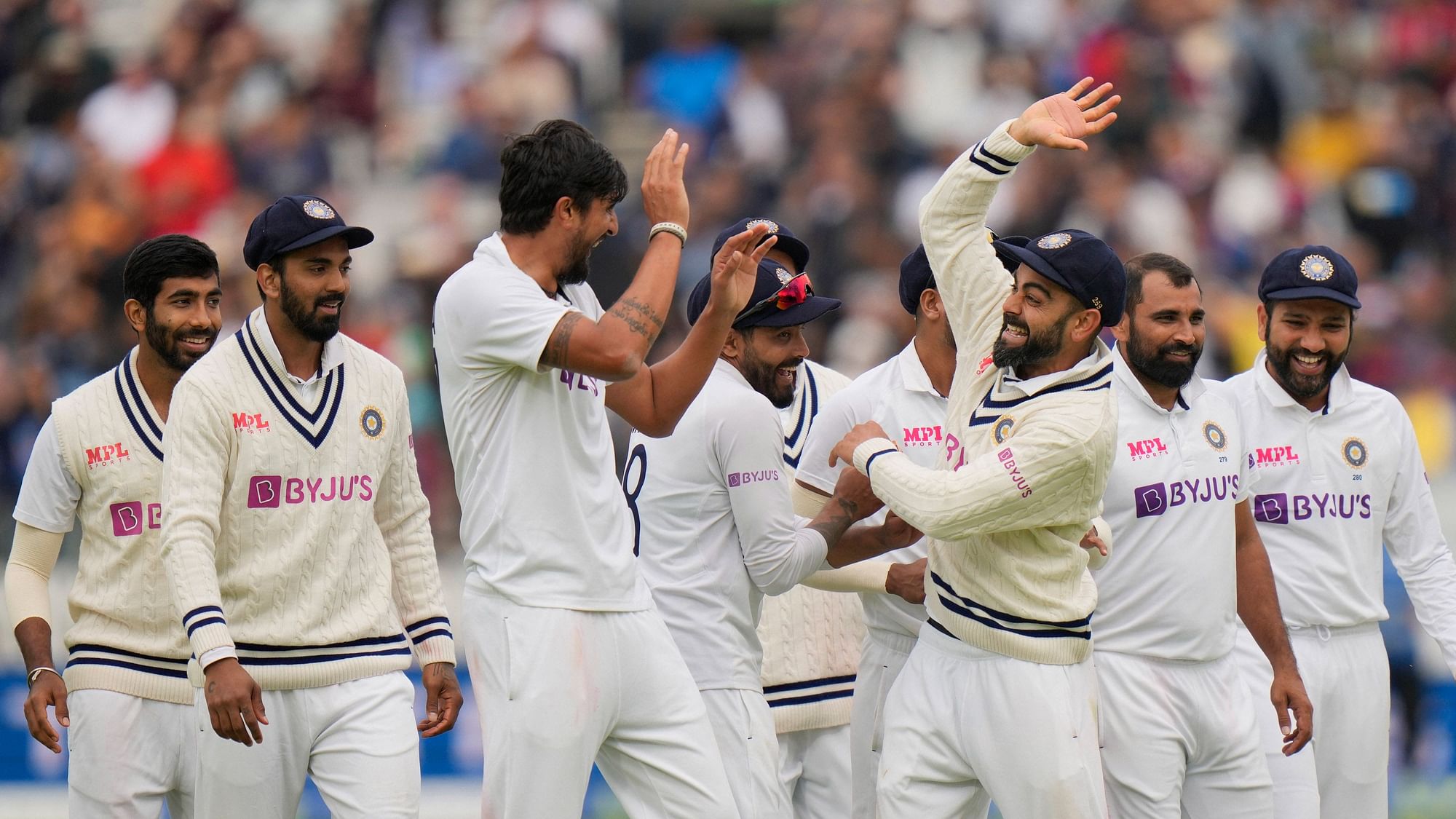<div class="paragraphs"><p>A Team Effort: Indian team celebrate the fall of an England wicket.</p></div>