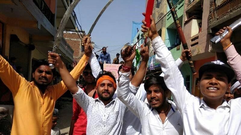 <div class="paragraphs"><p>Uttam (the one with the saffron cloth tied around his head) can be seen in several videos on social media, raising objectionable slogans against the minority community.</p></div>