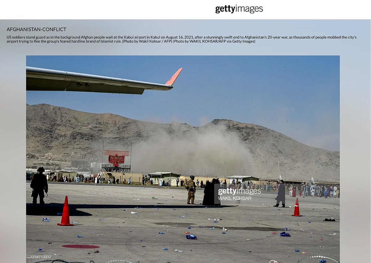 <div class="paragraphs"><p>The image shows Afghan people waiting at the Kabul airport.</p></div>