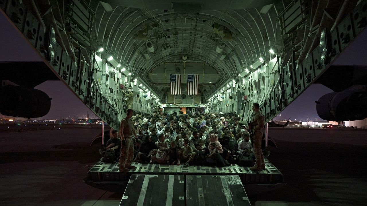 <div class="paragraphs"><p>Afghanistan Taliban Crisis LIVE. US Air Force aircrew, assist qualified evacuees boarding a US Air Force C-17 Globemaster III aircraft in support of the Afghanistan evacuation at Hamid Karzai International Airport.</p></div>