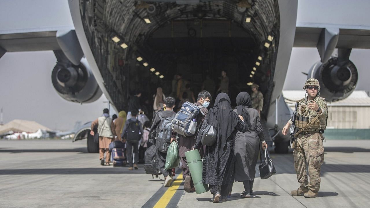 <div class="paragraphs"><p>Afghanistan Taliban Crisis LIVE. In this image provided by the US Marine Corps, families begin to board a US Air Force Boeing C-17 Globemaster III during an evacuation at Hamid Karzai International Airport in Kabul.</p></div>